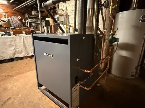 New dark gray boiler in a basement